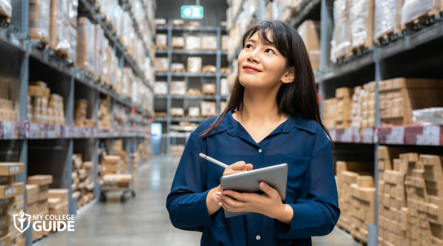 Logistician looking up and checks the number of items
