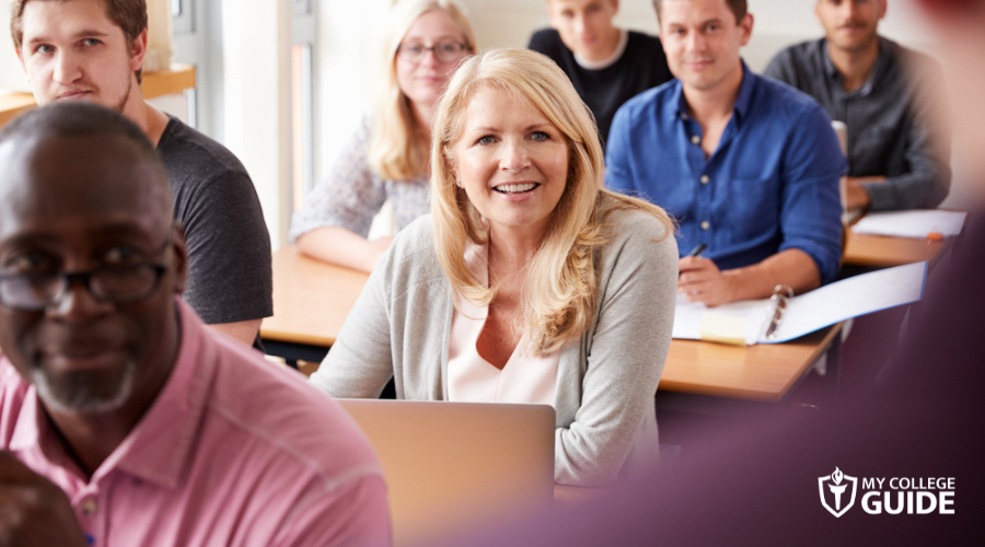adult students actively listening to professor 