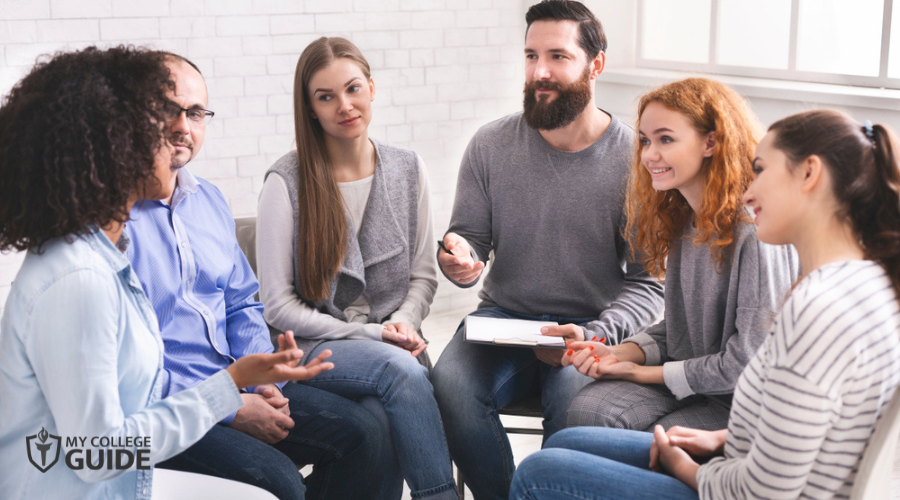 Psychologists and patients in a group therapy session
