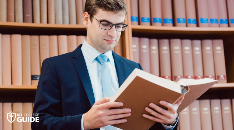 lawyer reading a book in his office