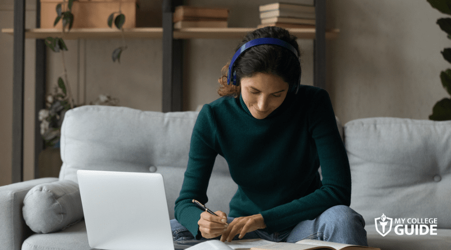 female student taking online class at home