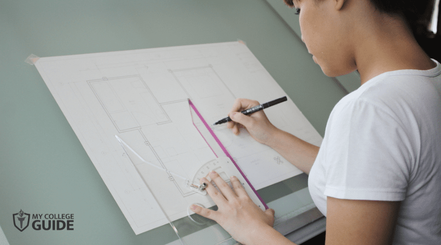 female architecture student working on her plan