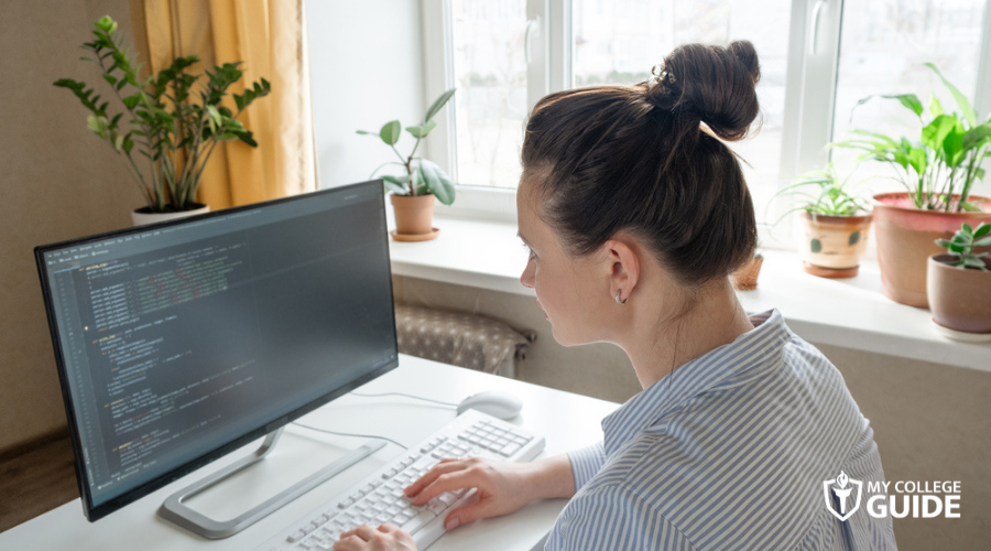 female programmer debugging the system