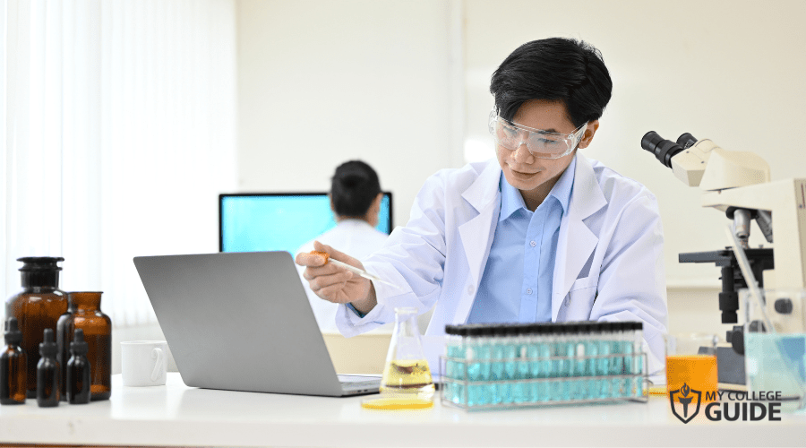 male chemist working on a project in laboratory