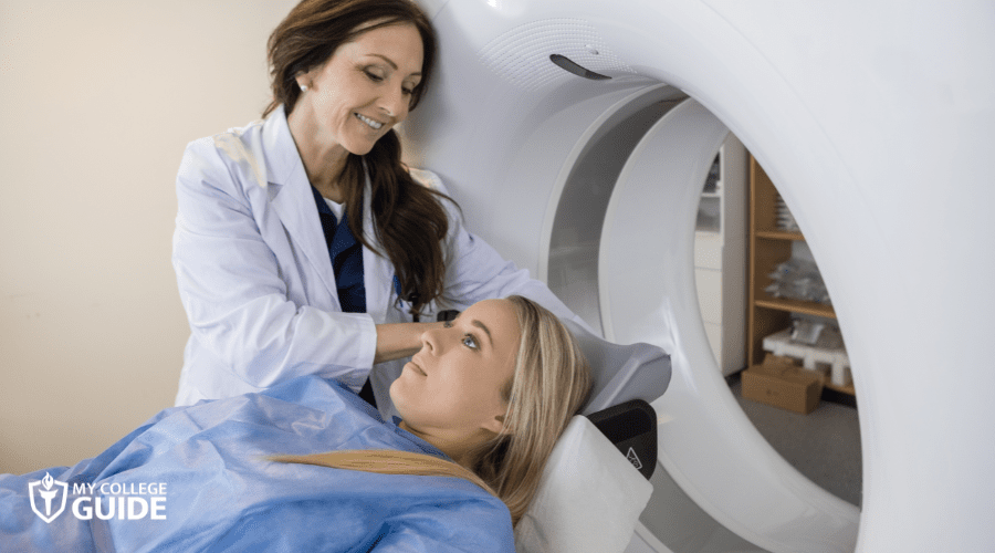 Doctor Preparing Patient For MRI Scan In Hospital