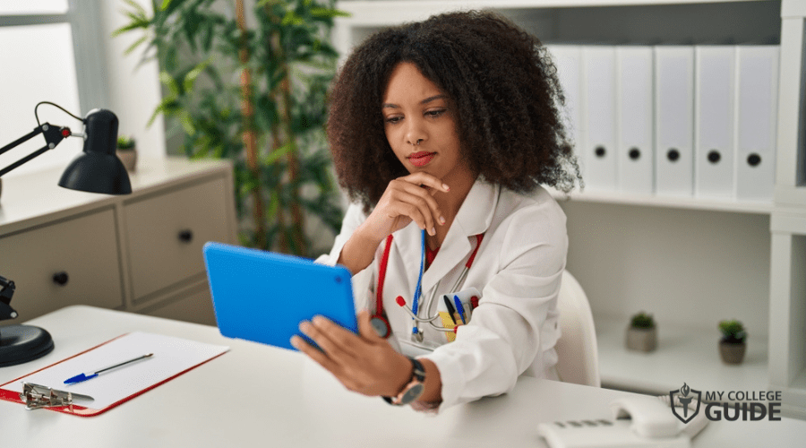 nurse checking the clients prescriptions online