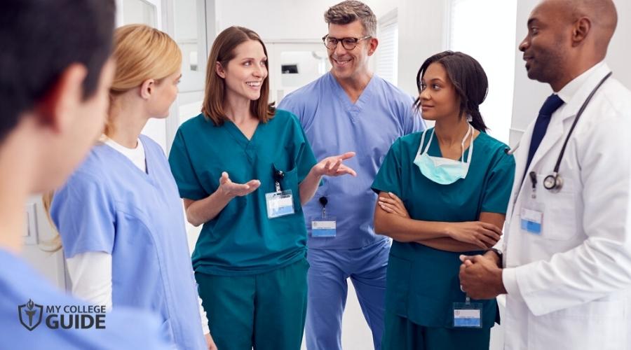 Nurses having a quick chat at hospital corridor