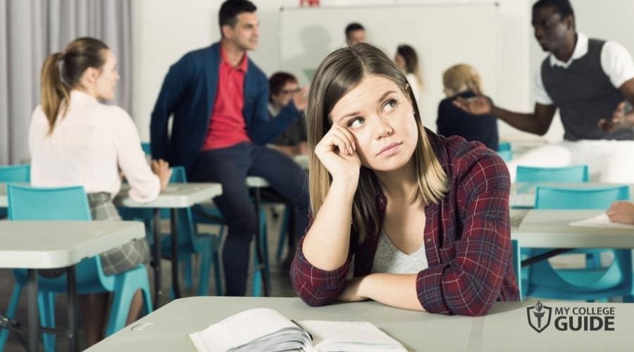 College Freshman Student sitting alone in her desk