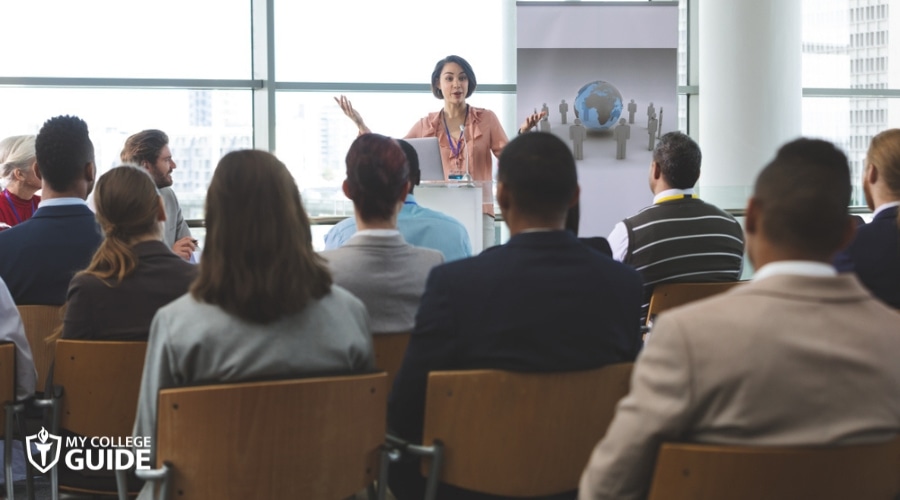 Woman giving speech in a public speaking event