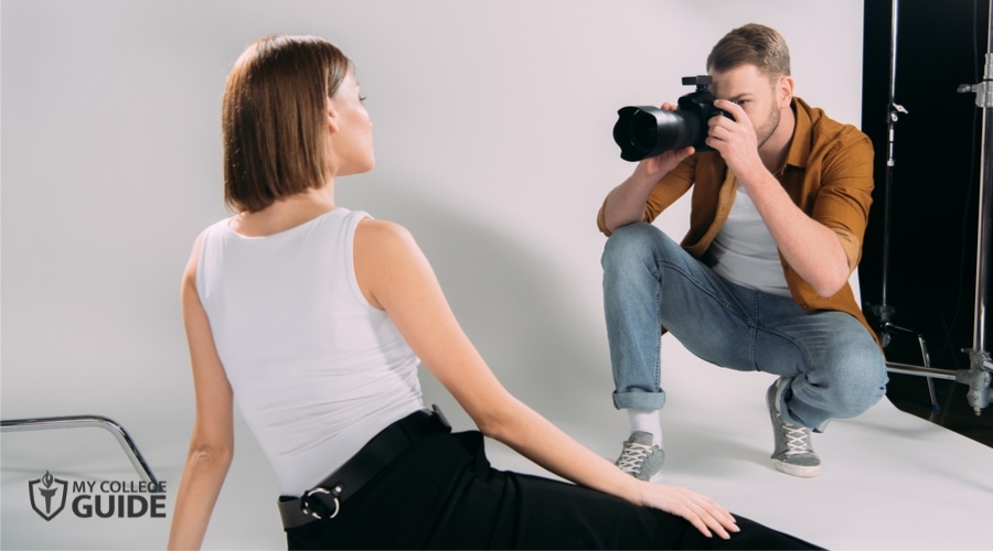 Fashion Photographer doing photoshoot with a model