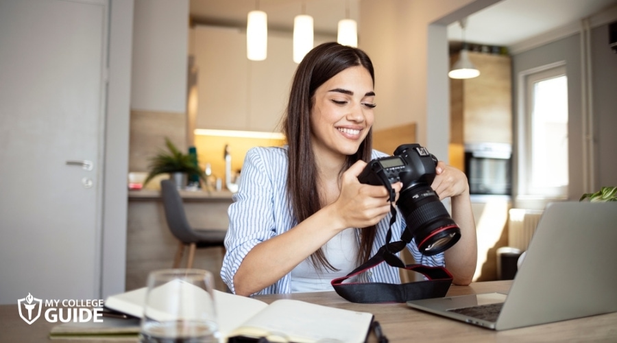 Woman taking Online Bachelors in Photography Degree