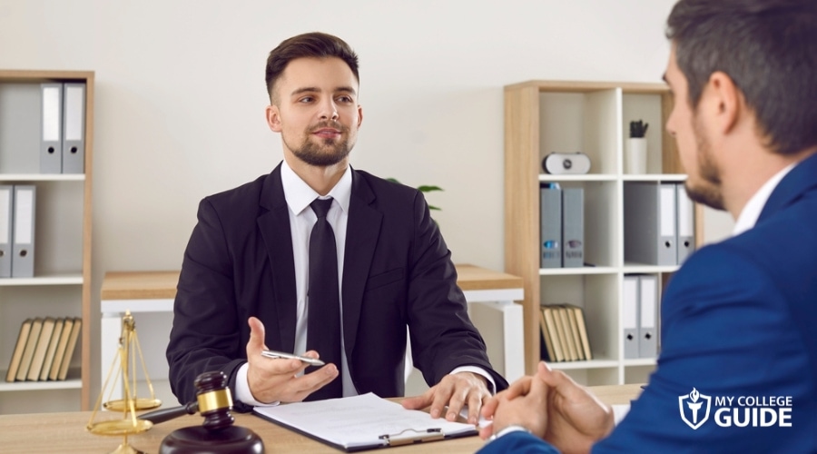 Lawyer with MLS degree, discussing with client