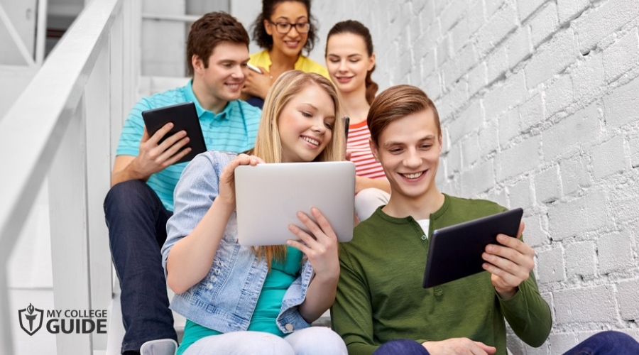 High School Students checking online for free internships