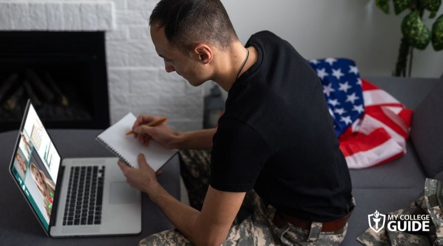 Military man taking online college with GI Bill benefits