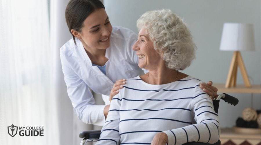 Occupational Therapist greeting her elderly patient on a wheelchair