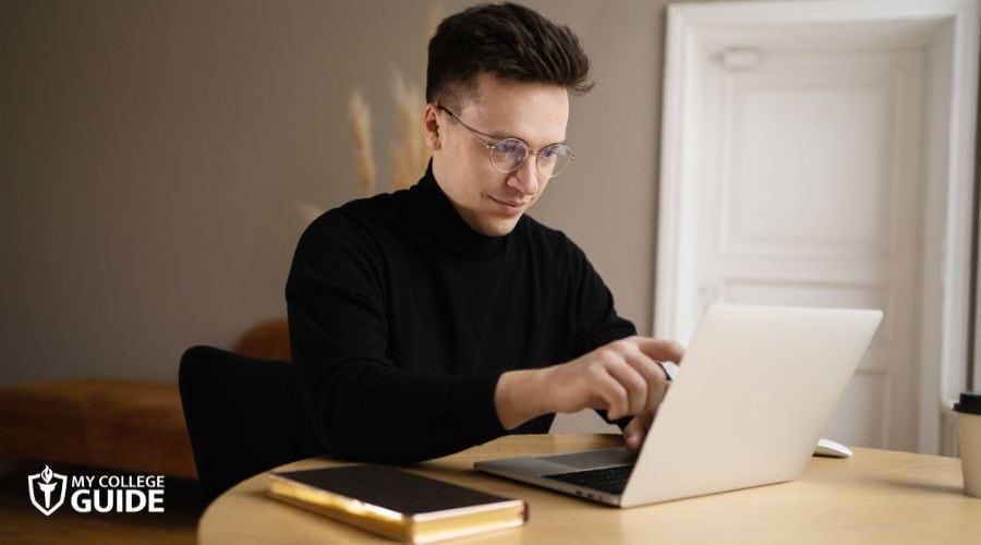 Man taking a quick online degree