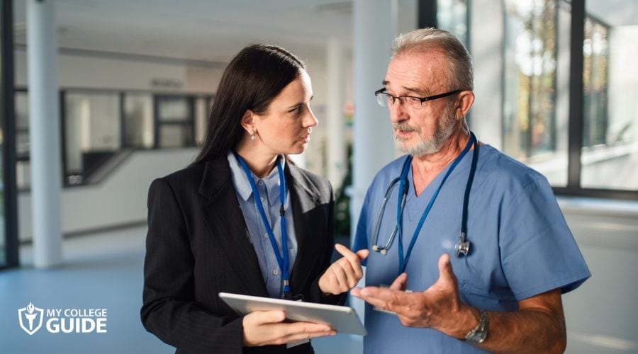 Hospital's Operations Specialties Manager talking to a doctor