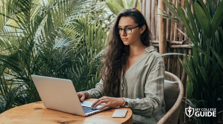 Woman taking Online Human Resources Degree