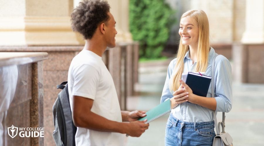 College transfer student talking to classmate